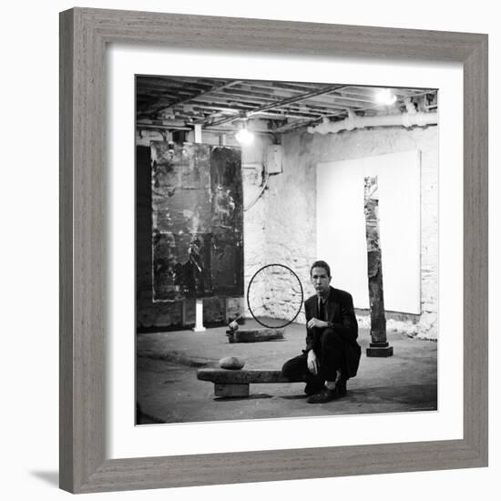 Robert Rauschenberg Sitting on His Sculpture in Studio, Among Other Paintings and Sculptures-Allan Grant-Framed Premium Photographic Print