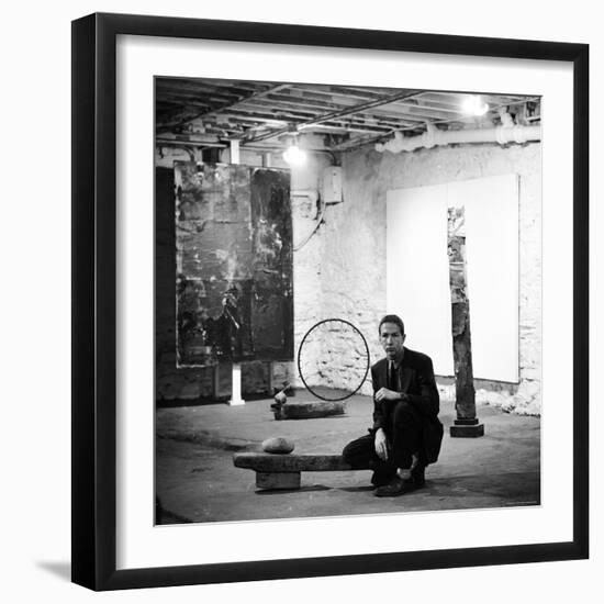 Robert Rauschenberg Sitting on His Sculpture in Studio, Among Other Paintings and Sculptures-Allan Grant-Framed Premium Photographic Print