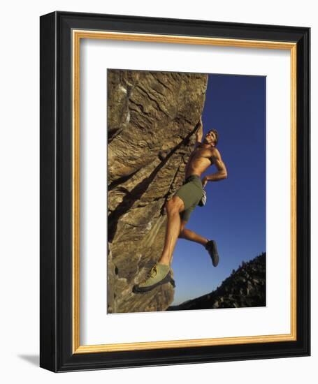 Rock Climber Hanging from Grip-null-Framed Photographic Print