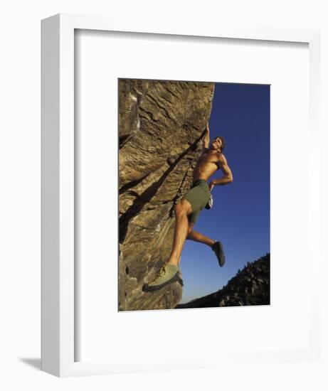 Rock Climber Hanging from Grip-null-Framed Photographic Print