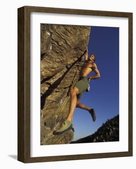 Rock Climber Hanging from Grip-null-Framed Photographic Print