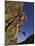 Rock Climber Hanging from Grip-null-Mounted Photographic Print