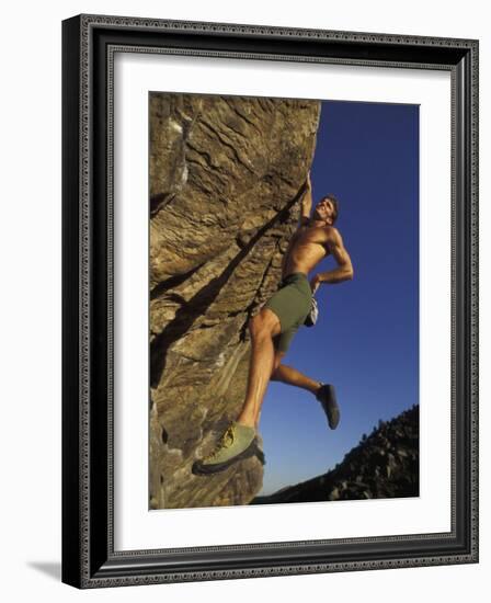 Rock Climber Hanging from Grip-null-Framed Photographic Print