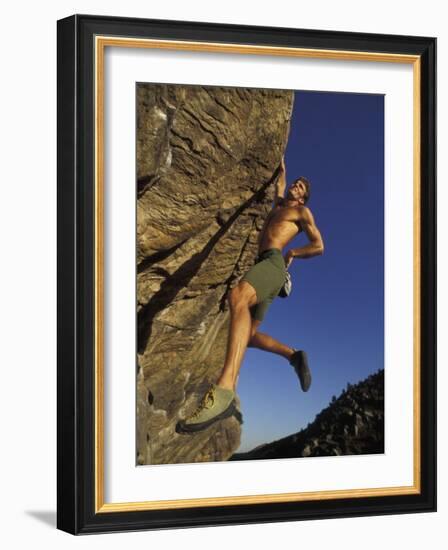 Rock Climber Hanging from Grip-null-Framed Photographic Print