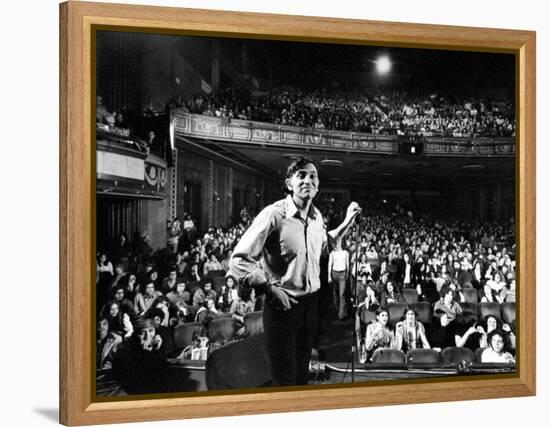 Rock Promoter Bill Graham Onstage with Audience Visible, at Fillmore East-John Olson-Framed Premier Image Canvas