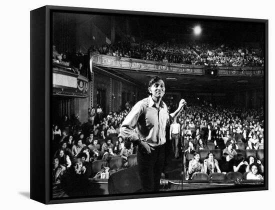 Rock Promoter Bill Graham Onstage with Audience Visible, at Fillmore East-John Olson-Framed Premier Image Canvas