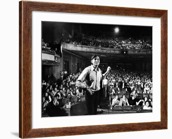 Rock Promoter Bill Graham Onstage with Audience Visible, at Fillmore East-John Olson-Framed Premium Photographic Print