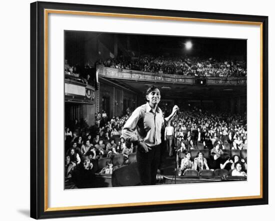 Rock Promoter Bill Graham Onstage with Audience Visible, at Fillmore East-John Olson-Framed Premium Photographic Print