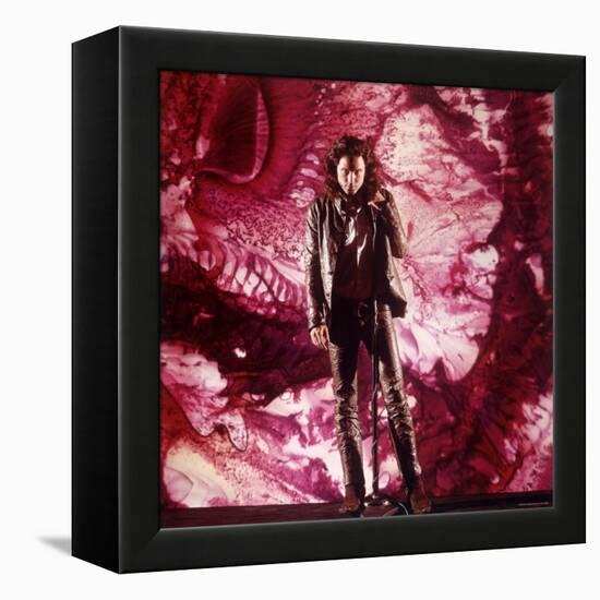Rock Star Jim Morrison of the Doors Singing Alone on Stage in Front of a Psychedelic Backdrop-Yale Joel-Framed Premier Image Canvas