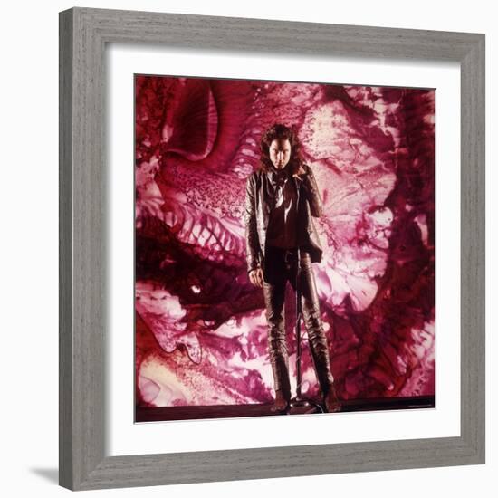 Rock Star Jim Morrison of the Doors Singing Alone on Stage in Front of a Psychedelic Backdrop-Yale Joel-Framed Premium Photographic Print