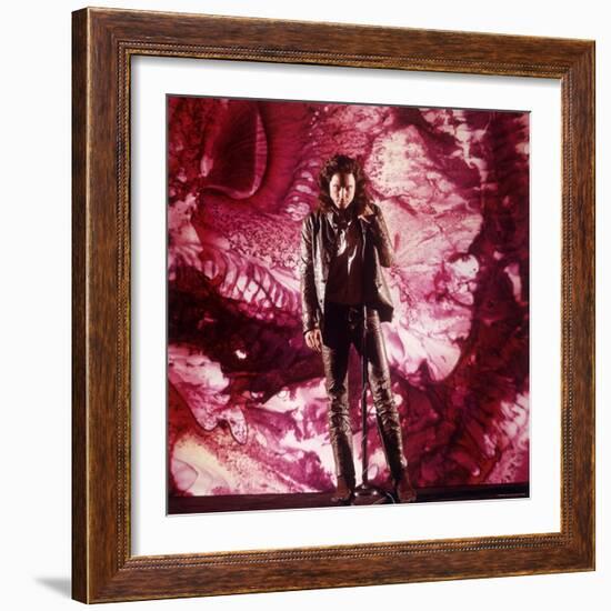 Rock Star Jim Morrison of the Doors Singing Alone on Stage in Front of a Psychedelic Backdrop-Yale Joel-Framed Premium Photographic Print