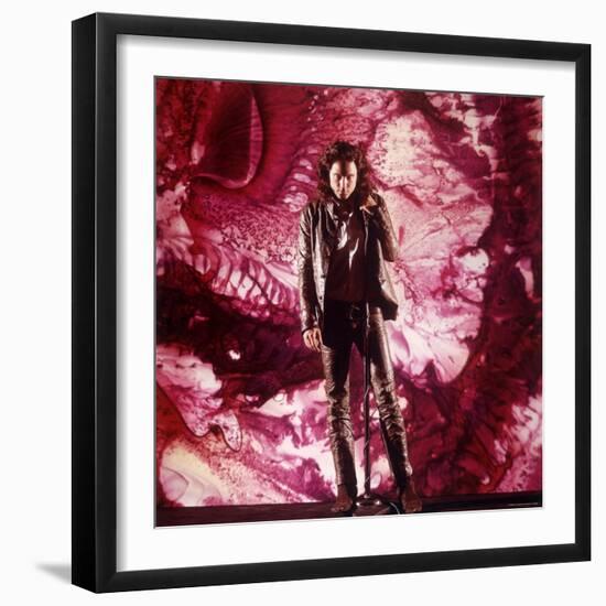 Rock Star Jim Morrison of the Doors Singing Alone on Stage in Front of a Psychedelic Backdrop-Yale Joel-Framed Premium Photographic Print