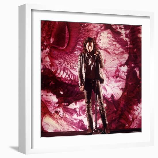 Rock Star Jim Morrison of the Doors Singing Alone on Stage in Front of a Psychedelic Backdrop-Yale Joel-Framed Premium Photographic Print