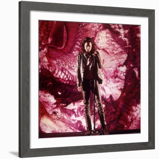 Rock Star Jim Morrison of the Doors Singing Alone on Stage in Front of a Psychedelic Backdrop-Yale Joel-Framed Premium Photographic Print