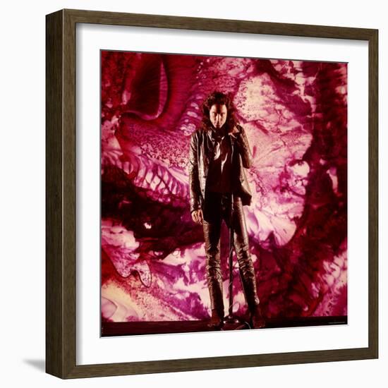 Rock Star Jim Morrison of The Doors Singing on Stage in Front of a Purple Psychedelic Backdrop-Yale Joel-Framed Premium Photographic Print