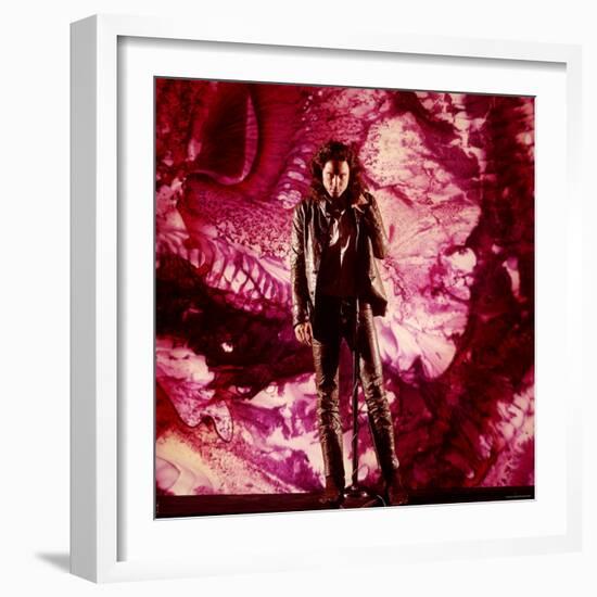 Rock Star Jim Morrison of The Doors Singing on Stage in Front of a Purple Psychedelic Backdrop-Yale Joel-Framed Premium Photographic Print