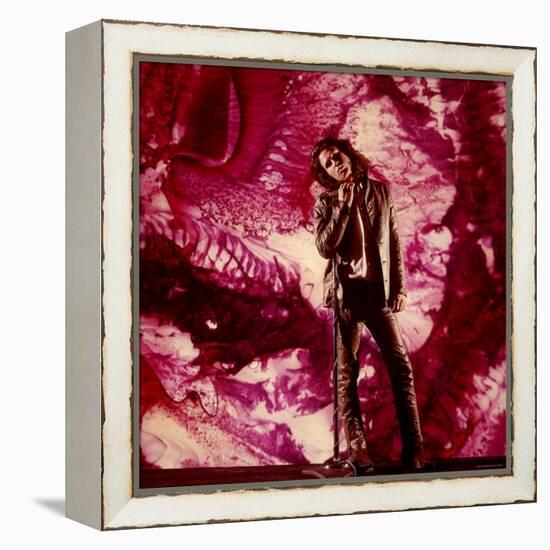 Rock Star Jim Morrison of the Doors Standing Alone in Front of a Purple Psychedelic Backdrop-Yale Joel-Framed Premier Image Canvas