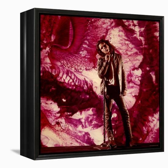 Rock Star Jim Morrison of the Doors Standing Alone in Front of a Purple Psychedelic Backdrop-Yale Joel-Framed Premier Image Canvas