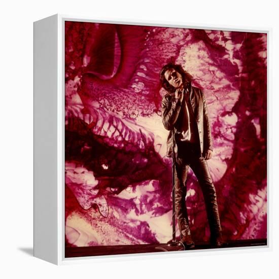 Rock Star Jim Morrison of the Doors Standing Alone in Front of a Purple Psychedelic Backdrop-Yale Joel-Framed Premier Image Canvas