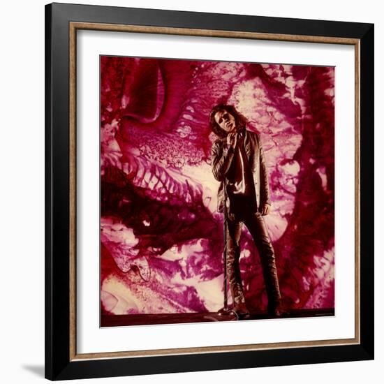 Rock Star Jim Morrison of the Doors Standing Alone in Front of a Purple Psychedelic Backdrop-Yale Joel-Framed Premium Photographic Print