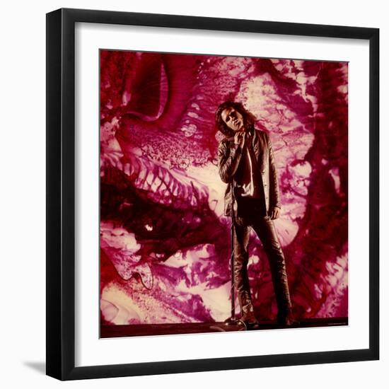 Rock Star Jim Morrison of the Doors Standing Alone in Front of a Purple Psychedelic Backdrop-Yale Joel-Framed Premium Photographic Print