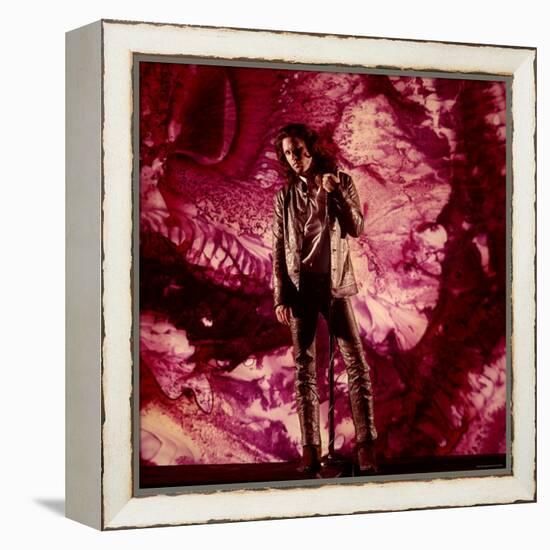 Rock Star Jim Morrison of the Doors Standing Alone in Front of a Purple Psychedelic Background-Yale Joel-Framed Premier Image Canvas