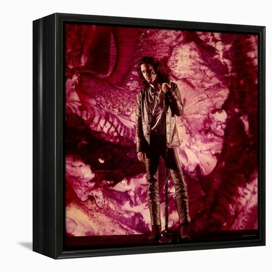 Rock Star Jim Morrison of the Doors Standing Alone in Front of a Purple Psychedelic Background-Yale Joel-Framed Premier Image Canvas