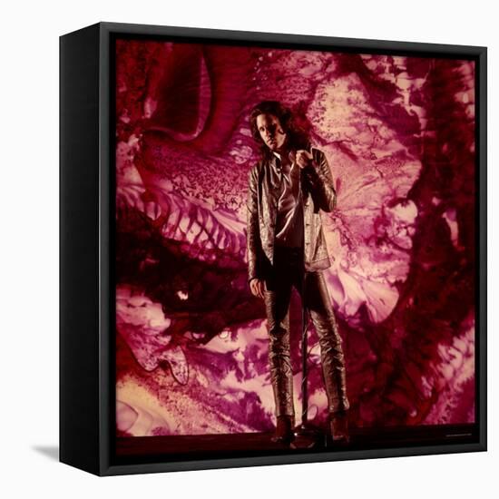 Rock Star Jim Morrison of the Doors Standing Alone in Front of a Purple Psychedelic Background-Yale Joel-Framed Premier Image Canvas