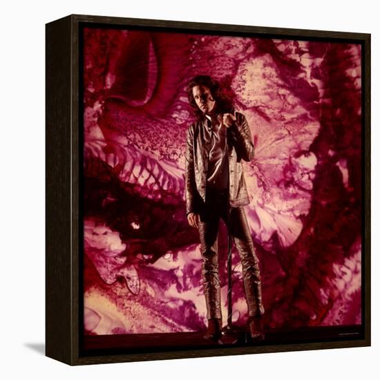 Rock Star Jim Morrison of the Doors Standing Alone in Front of a Purple Psychedelic Background-Yale Joel-Framed Premier Image Canvas