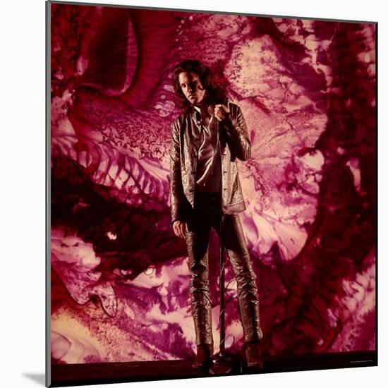 Rock Star Jim Morrison of the Doors Standing Alone in Front of a Purple Psychedelic Background-Yale Joel-Mounted Premium Photographic Print