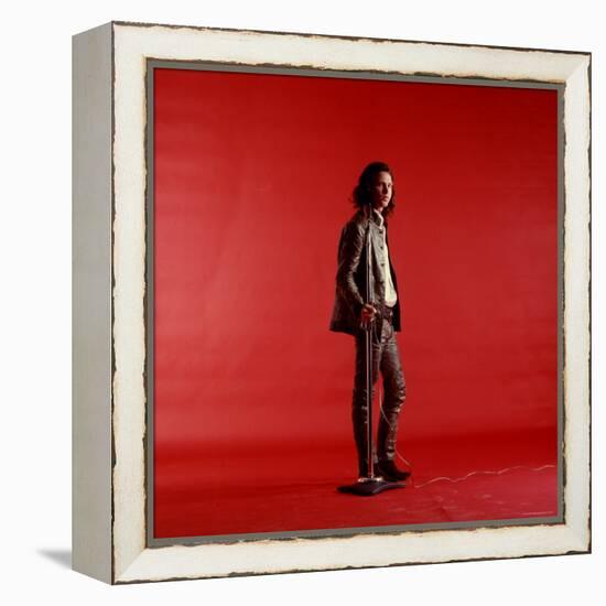 Rock Star Jim Morrison of the Doors Standing Alone Next to Microphone in Front of a Red Backdrop-Yale Joel-Framed Premier Image Canvas