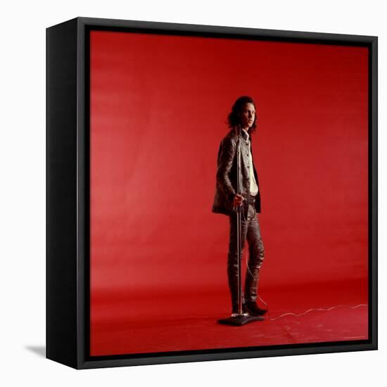 Rock Star Jim Morrison of the Doors Standing Alone Next to Microphone in Front of a Red Backdrop-Yale Joel-Framed Premier Image Canvas