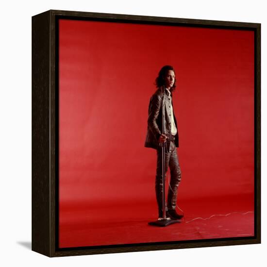 Rock Star Jim Morrison of the Doors Standing Alone Next to Microphone in Front of a Red Backdrop-Yale Joel-Framed Premier Image Canvas