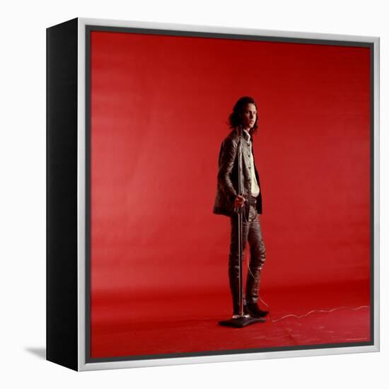 Rock Star Jim Morrison of the Doors Standing Alone Next to Microphone in Front of a Red Backdrop-Yale Joel-Framed Premier Image Canvas