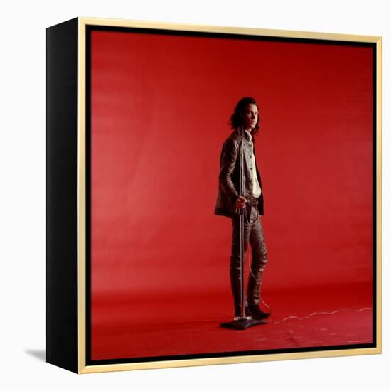 Rock Star Jim Morrison of the Doors Standing Alone Next to Microphone in Front of a Red Backdrop-Yale Joel-Framed Premier Image Canvas