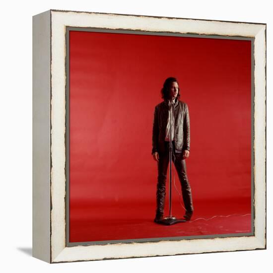 Rock Star Jim Morrison of the Doors Standing Behind Microphone Alone Against a Red Backdrop-Yale Joel-Framed Premier Image Canvas