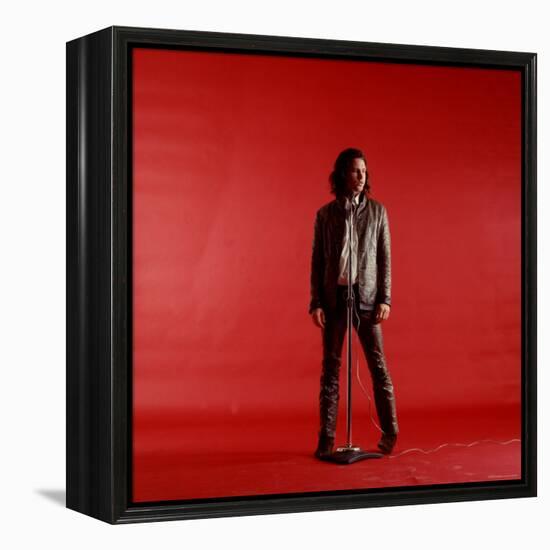 Rock Star Jim Morrison of the Doors Standing Behind Microphone Alone Against a Red Backdrop-Yale Joel-Framed Premier Image Canvas