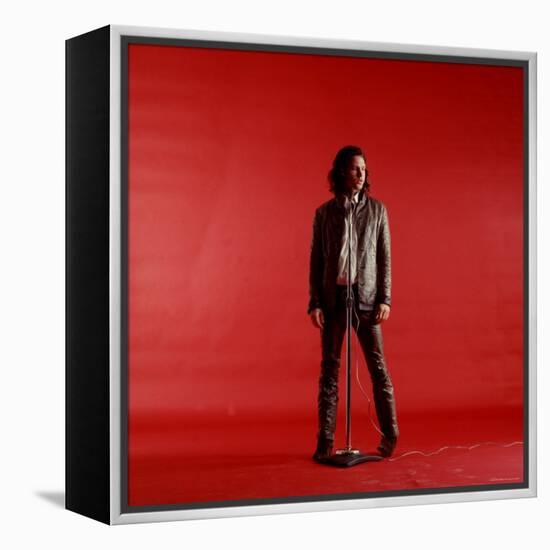 Rock Star Jim Morrison of the Doors Standing Behind Microphone Alone Against a Red Backdrop-Yale Joel-Framed Premier Image Canvas