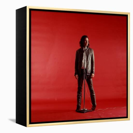 Rock Star Jim Morrison of the Doors Standing Behind Microphone Alone Against a Red Backdrop-Yale Joel-Framed Premier Image Canvas