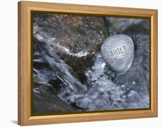 Rock with the Word Smile in Rushing Water-null-Framed Premier Image Canvas