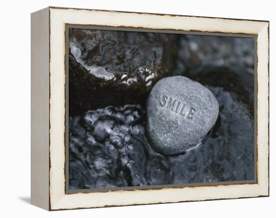 Rock with the Word Smile in Rushing Water-null-Framed Premier Image Canvas