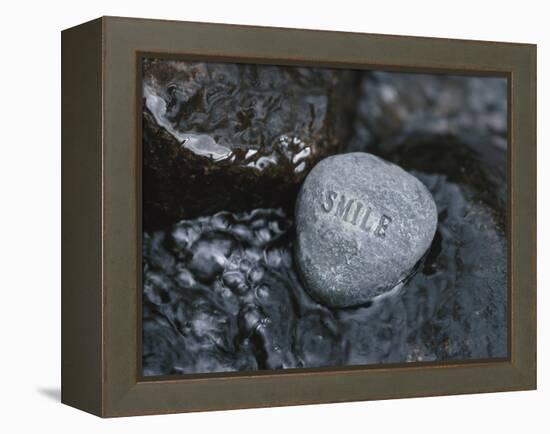 Rock with the Word Smile in Rushing Water-null-Framed Premier Image Canvas