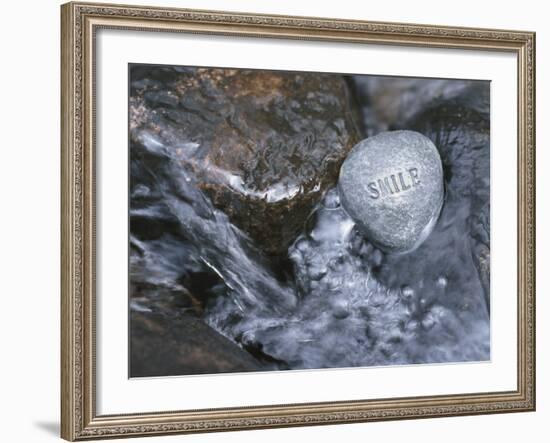 Rock with the Word Smile in Rushing Water--Framed Photographic Print