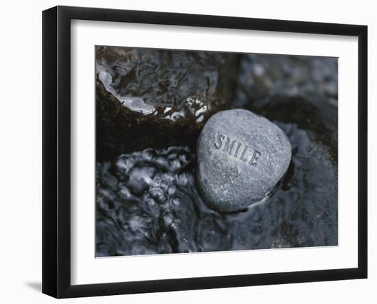 Rock with the Word Smile in Rushing Water-null-Framed Photographic Print