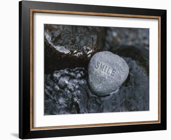 Rock with the Word Smile in Rushing Water-null-Framed Photographic Print