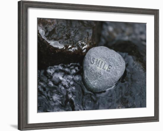 Rock with the Word Smile in Rushing Water-null-Framed Photographic Print