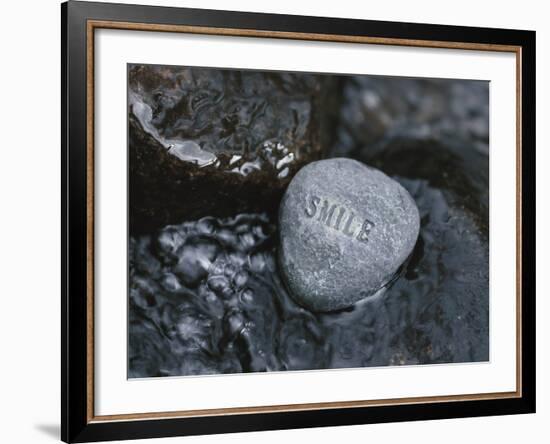 Rock with the Word Smile in Rushing Water-null-Framed Photographic Print