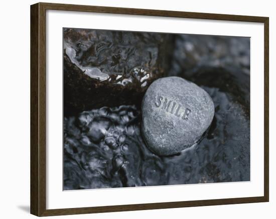 Rock with the Word Smile in Rushing Water-null-Framed Photographic Print