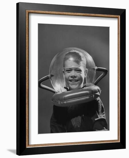 Rocket Ship Prize, Boy Wearing Space Helmet-Yale Joel-Framed Photographic Print