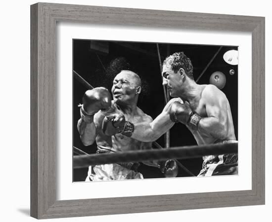 Rocky Marciano Landing a Punch on Jersey Joe Walcott, Sept. 23, 1952-null-Framed Photo